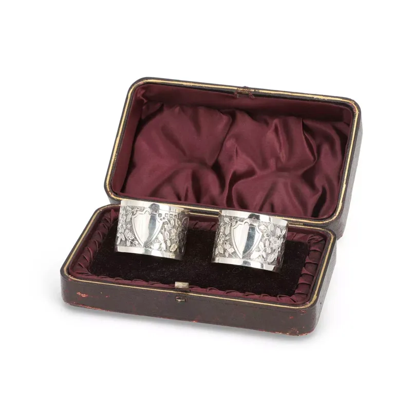 A Pair Of Late Victorian Silver Napkin Rings by James Deakin & Sons, Sheffield 1891, each chased with a foliate band, vacant cartouches