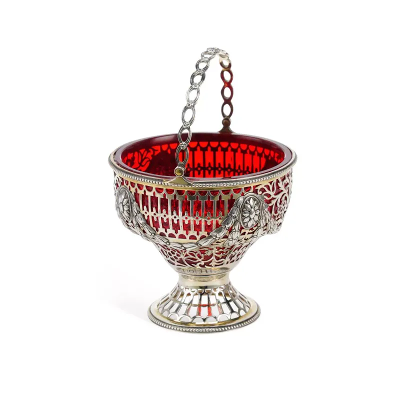 An Edwardian Pierced Silver Sugar Basket maker's marks rubbed, possibly by George Fox, London 1903, pierced with foliate motif, embossed with swags