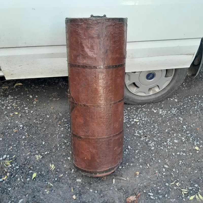 Interesting leather covered tube shaped early 20th century case converted now to a frees standing cupboard