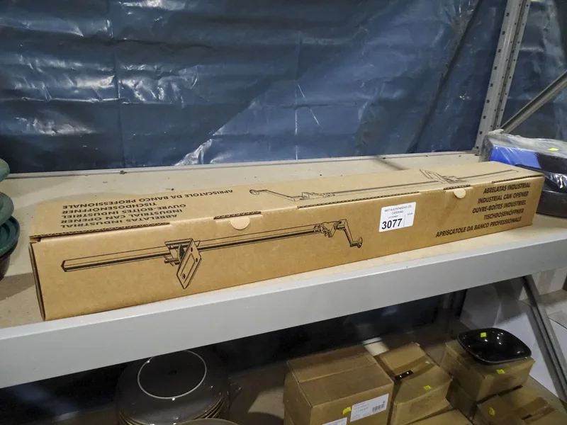 VAT A boxed unused commercial tin opener