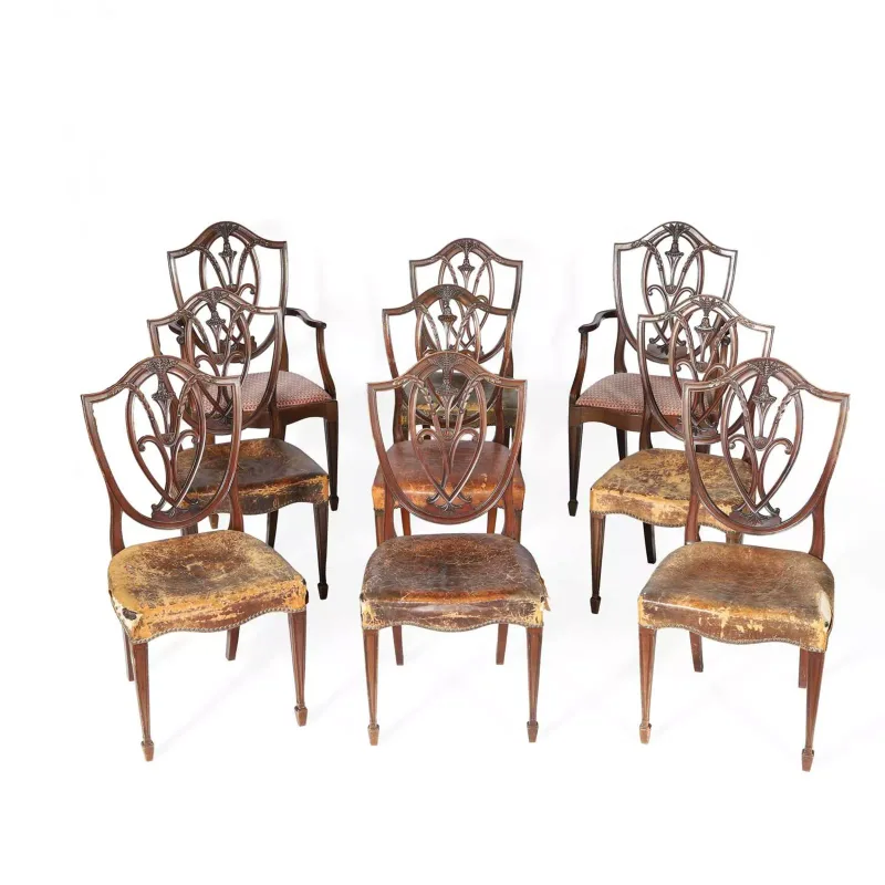 Nine Hepplewhite Style Mahogany Dining Chairs early 20th Century, comprising two armchairs and seven single chairs, each with a shield back