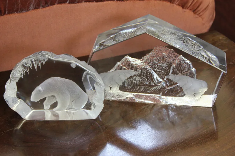 An Orrefors glass relief decorated sculpture of mountain and figures of polar bears,