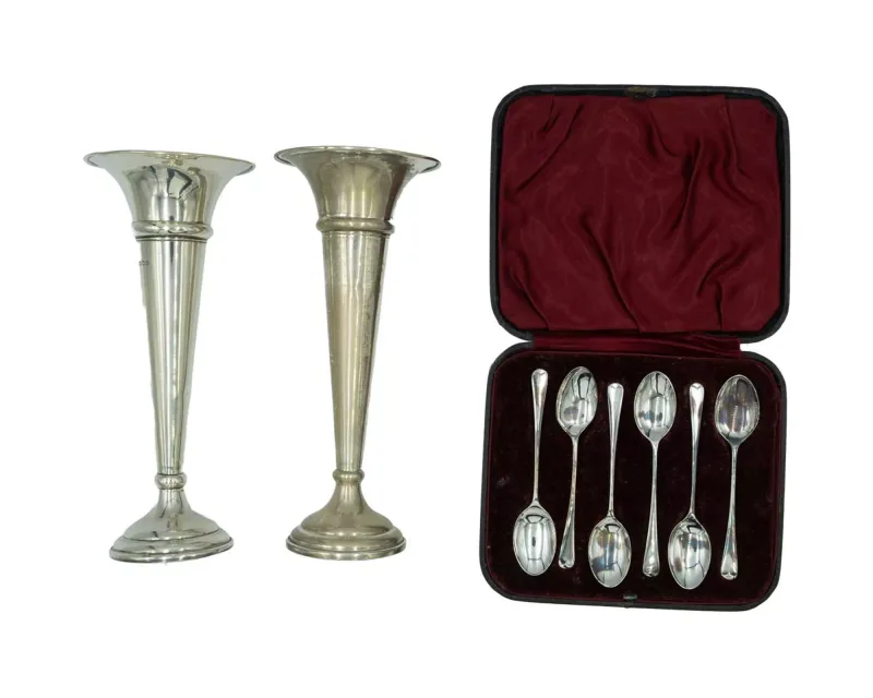 A pair of silver trumpet vases by Charles Boyton & Son Ltd