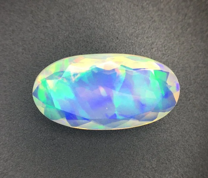 1 pcs Orange Opal - 8.66 ct - International Gemological Institute (IGI) - NATURAL COLOR PLAY OPAL