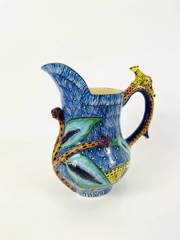 An Ardmore Studio pottery jug with applied floral decoration and hyena, fully marked to the underside 'Made by Octavia, painted by Nomusa