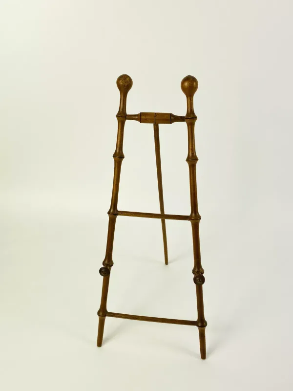 An attractive early 20th century miniature faux bamboo table top easel stand (probably French). 14.75cms wide x 35.5cms high
