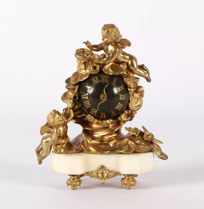 Dufaud, Paris A Fine and Small Ormolu Mantel Clock A Fine and Small Ormolu Mantel Clock by Dufaud, Paris
