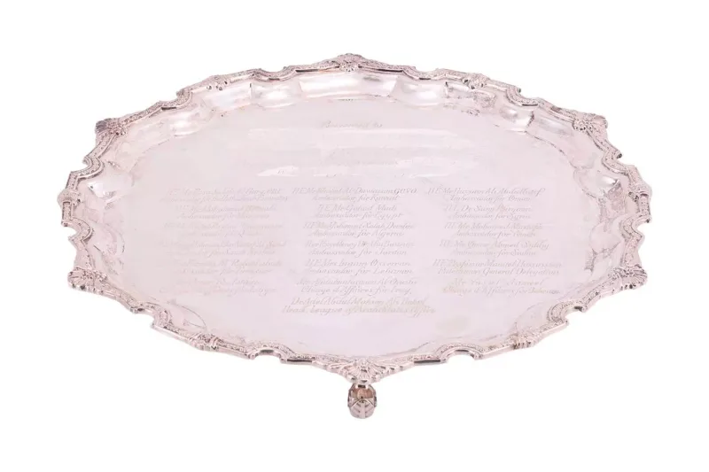 A silver presentation salver, by William & Son (William Asprey) London 2007, of circular form, pie crust rim decorated with shell and floral motifs