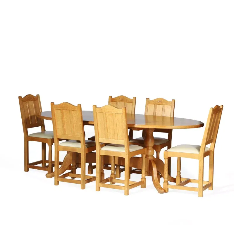 A Graham Duncalf Swanman Oak Dining Table And Six Chairs by Graham Duncalf, the Swanman