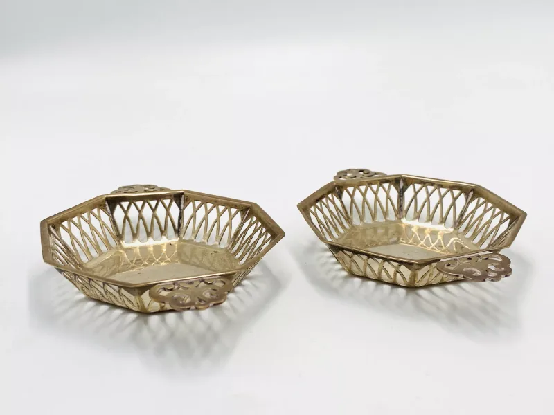 A pair of pierced silver two handled bonbon dishes,