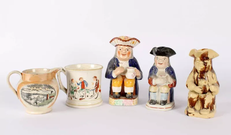 Three 19th Century Staffordshire Pottery Toby Jugs Three 19th Century Staffordshire Pottery Toby Jugs , of varying sizes and glazes
