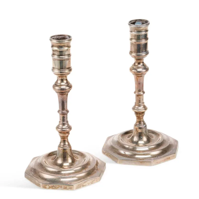A Pair Of 18th Century Silver Candlesticks continental, possibly Dutch, maker's mark Emb, in Queen Anne style, on octagonal bases, with knopped baluster stems