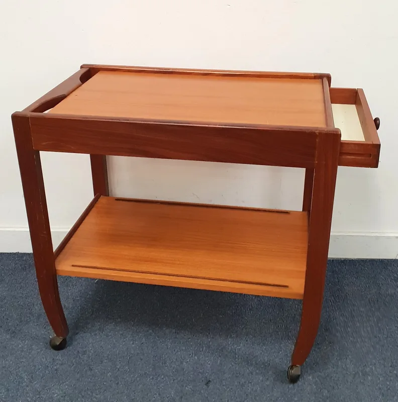 Mid Century Teak Two-Tier Drinks Trolley the rectangular top with raised tray edges and integrated cutout lug handles to one end