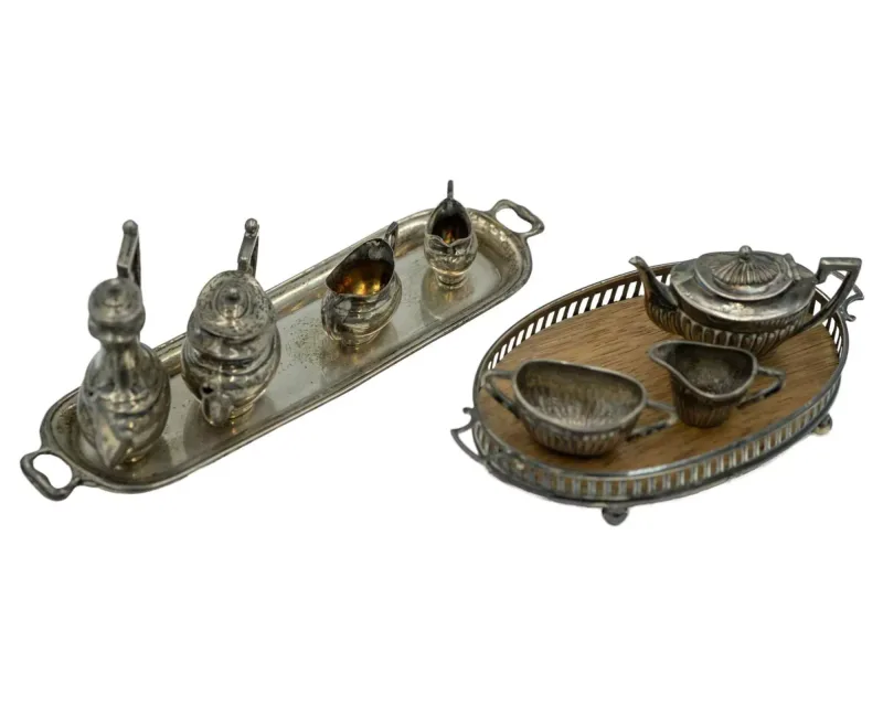A miniature doll's house silver tea set by Henry Matthews