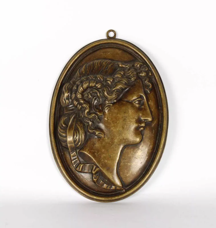 A 19th Century Neoclassical Cast and Patinated Bronze Oval Wall Plaque A 19th Century Neoclassical Cast and Patinated Bronze Oval Wall Plaque