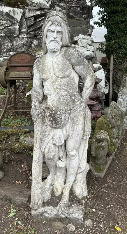 A cast reconstituted stone sculpture of Hercules The sculpture, after the antique