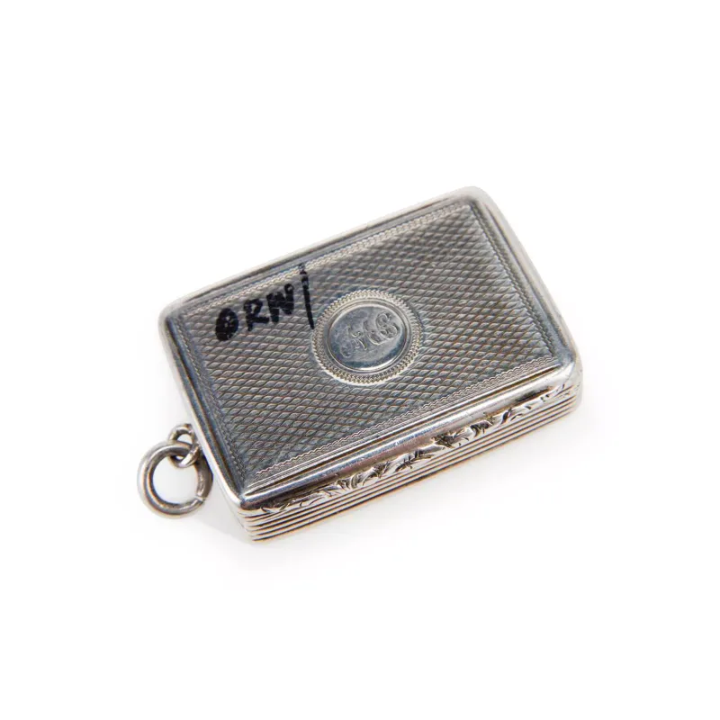 An Early Victorian Silver Vinaigrette maker's mark Wp, London 1837, of rectangular form with a hinged cover, engine-turned, with a monogram engraved cartouche