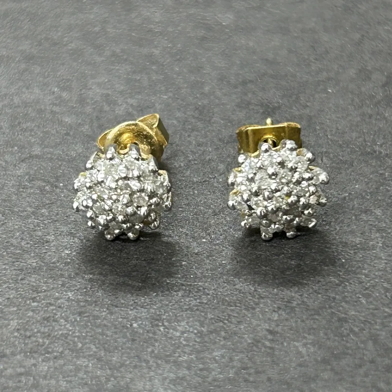 A pair of 18ct gold and diamond chip earrings (one butterfly back yellow metal), total weight approx. 2.1g