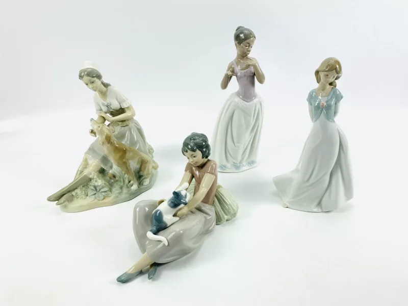 A collection of four Nao porcelain figurines to include 'Truly in Love', model No.1450 (14cms wide x 9cms deep x 25.5cms high)