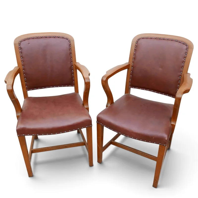 A Pair of Edwardian Oak and Leather Desk Chairs