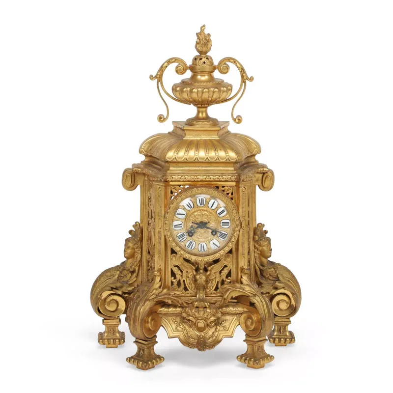 A French Gilt Bronze Mantel Clock late 19th Century, in the Louis XIV taste