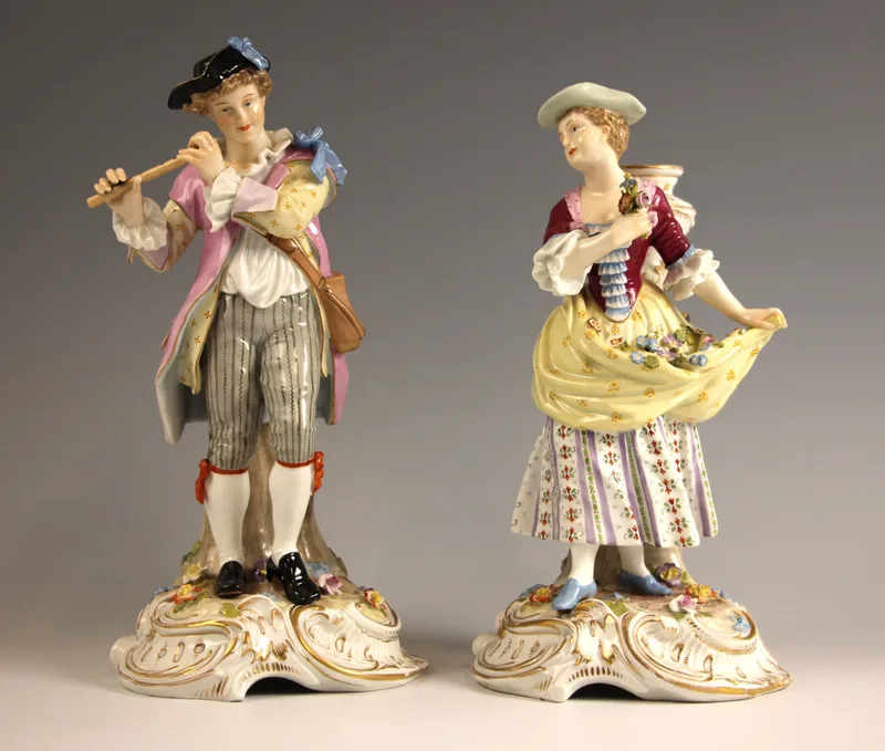 A pair of Dresden porcelain figures by Carl Thieme, early 20th century, one modelled as a flautist,