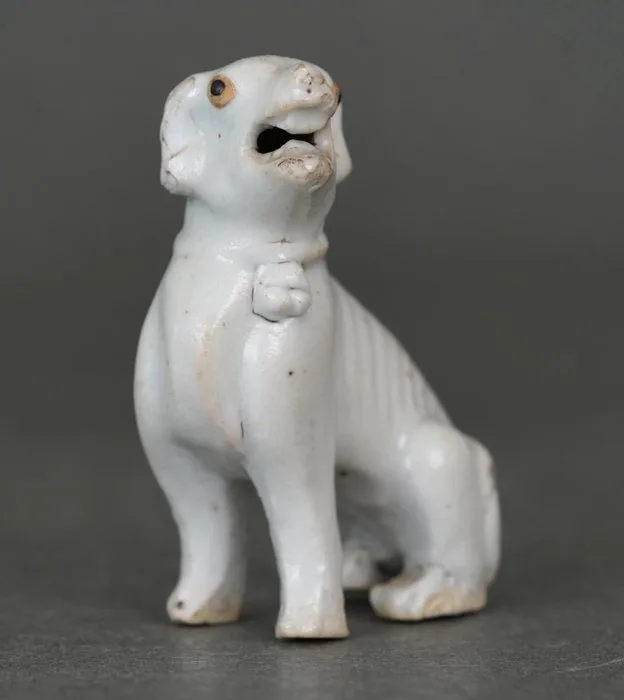 Qingbai Glazed - Seated Hound or Dog With Black Oxide Eyes and Open Mouth - Curled Tail and Collar - Porcelain - China - Yongzheng (1723-1735)