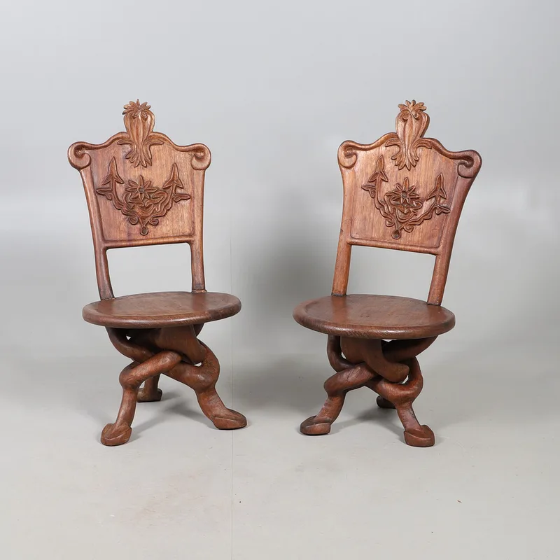 A Pair of Carved Gaudi Style Chairs