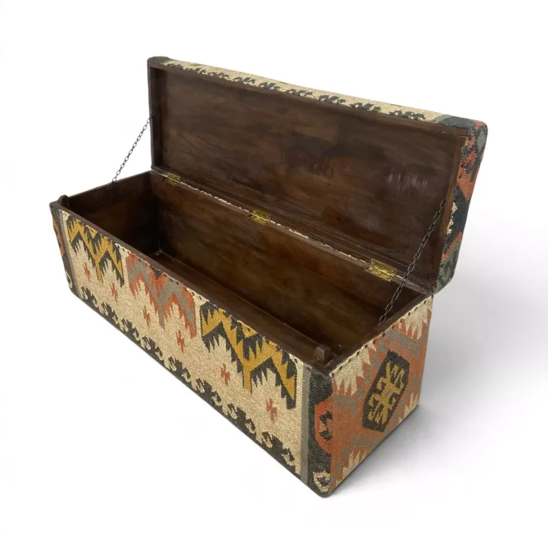 A contemporary flatweave kilim upholstered chest or trunk with a geometric polychrome pattern and a hinged lid