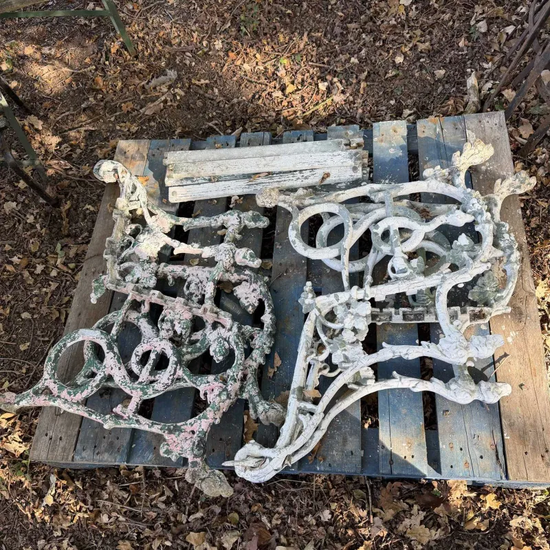 Two pairs of Victorian style garden bench ends The cast aluminium bench ends each with hounds head finials to the arm terminals