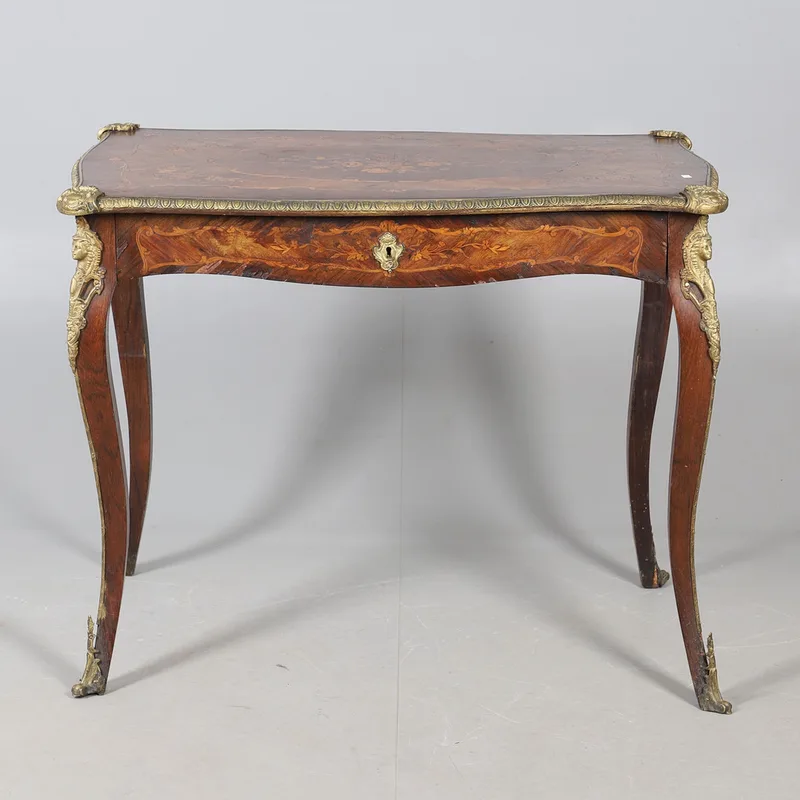 A Louis XV style mahogany side table, with a marquetry inlay to the top, a single long drawers