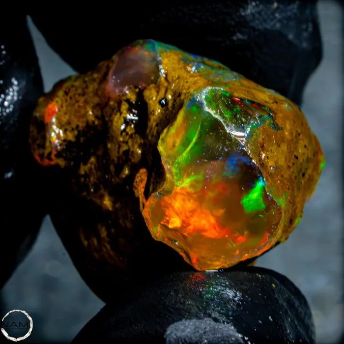 Crystal Opal – rough stone with spectacular play of color 45.6- 9.12 g