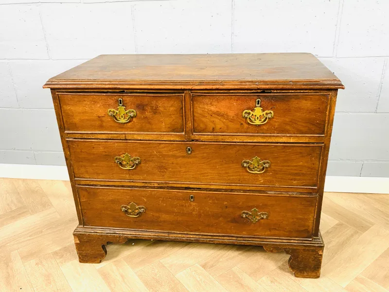 A Georgian fruitwood chest of drawers