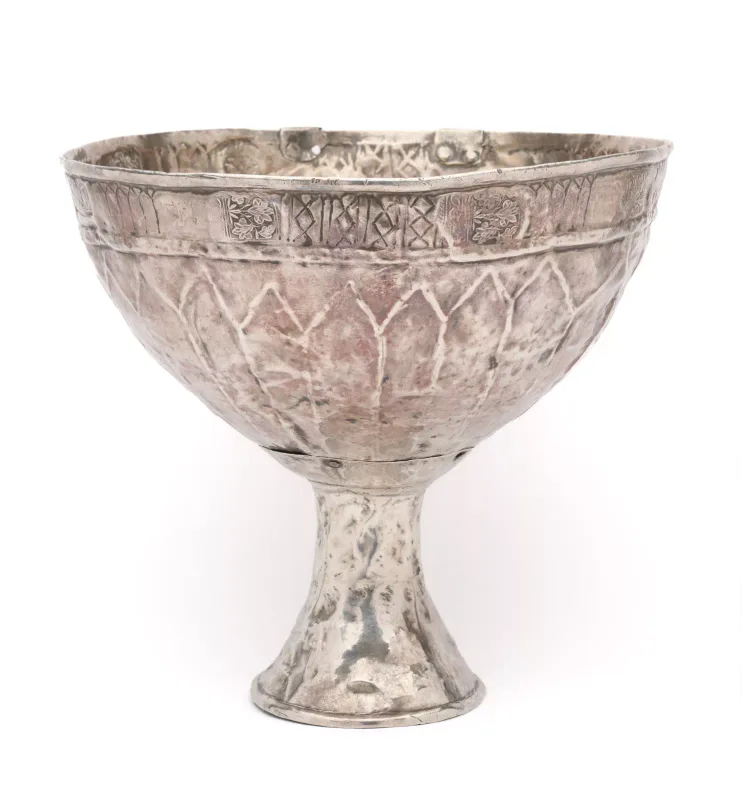 A Rare Silver Wine Goblet, Nuristan, Afghanistan, 19th Century the wide bowl with stylised repousse leaf design