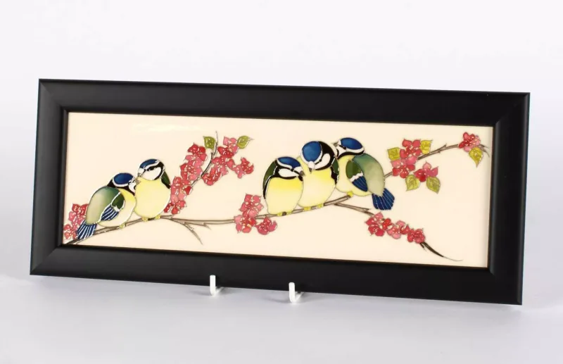 'Balancing Bird' Plaque by Moorcroft 'Balancing Bird' Plaque by Moorcroft, with tubline decoration on cream background, presented in a black frame