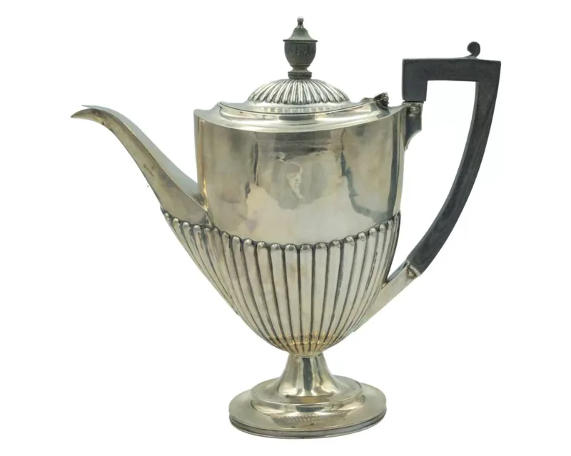 A Victorian silver hot water jug by Henry Hobson & Sons
