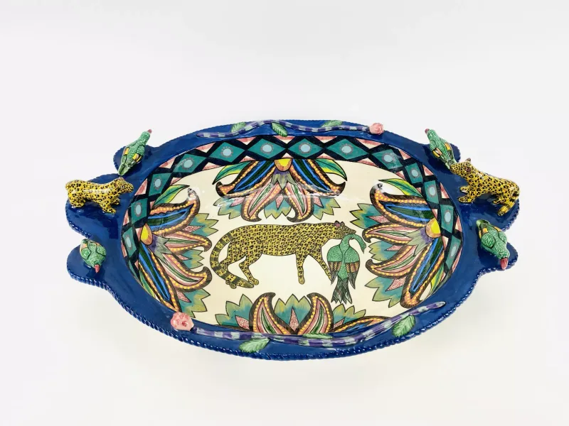 A rare and unusually large Ardmore Studio pottery oval bowl, decorated with applied hyena and bird decoration, fully marked to the underside 'Made by Octavia