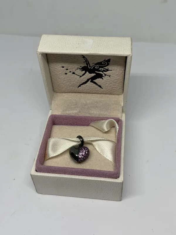 A Pandora Silver Charm in a Presentation Box