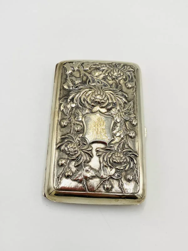 A white metal cigar case with engraved initials, 164g