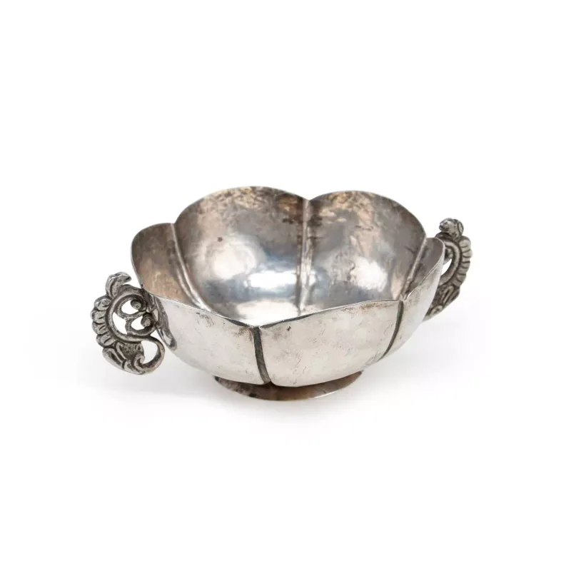 A Mexican Silver Twin-Handle Bowl 20th Century, variously marked Mexico, of circular lobed form, the pierced handles with zoomorphic characters.