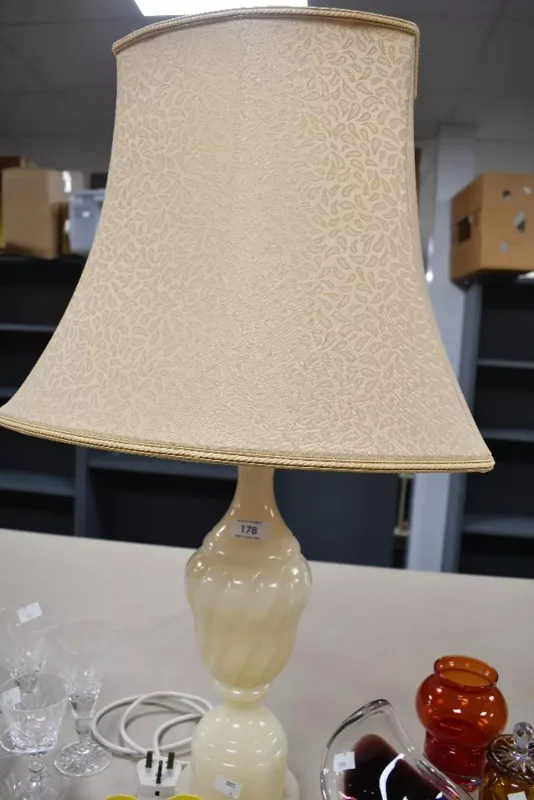 A vintage hard stone alabaster type table lamp, of urn-form with a cream shade, unmarked,