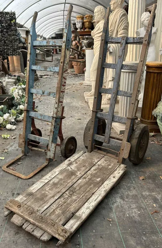 Two old ash and wrought iron market barrows The barrows painted with the owners name 'J Egan' and carved with the address '93a 14 Stukeley Street WC2'