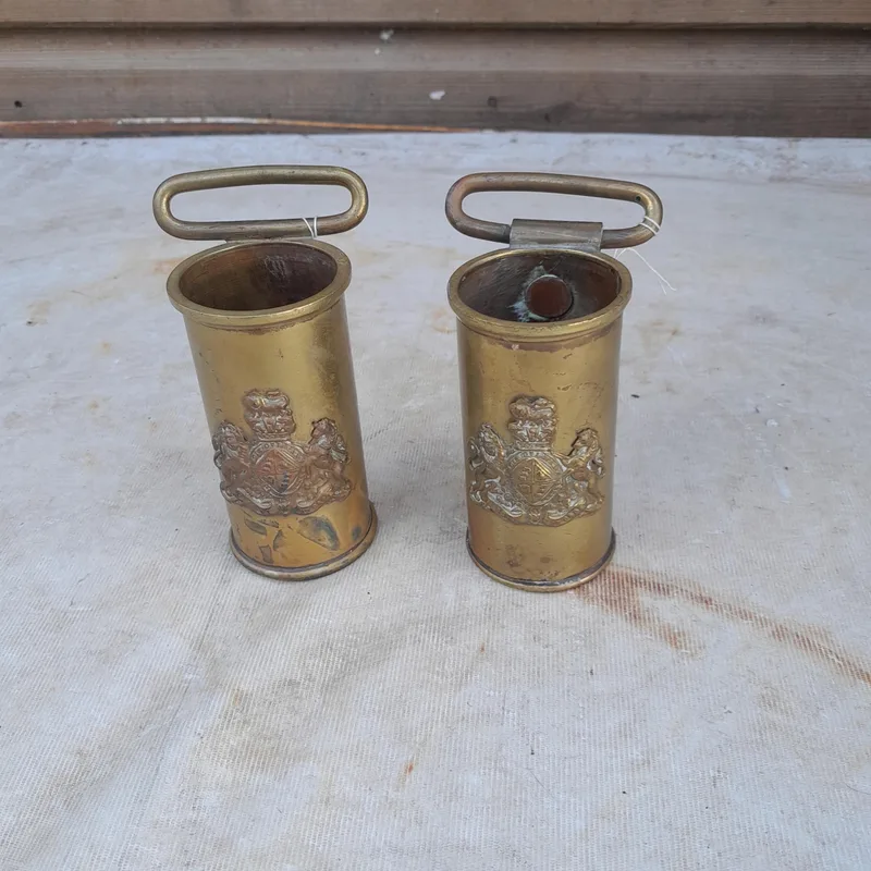 Pair of early 20th century brass flag holders with crests