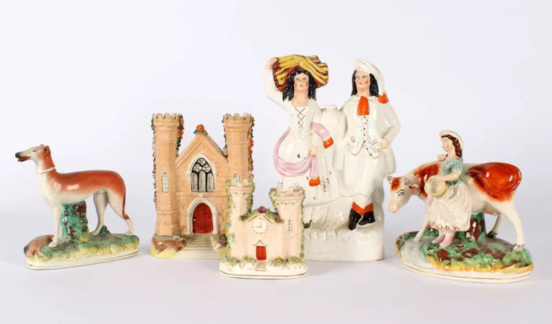 A 19th Century Staffordshire Pottery Group of Five A 19th Century Staffordshire Pottery Group of Five , comprising a husband and wife group, a greyhound figure