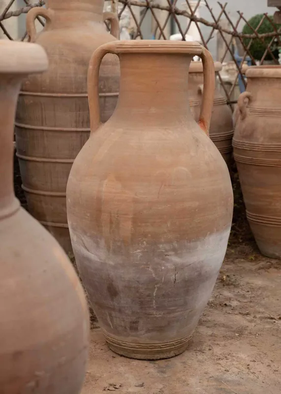 A large North African storage jar The terracotta storage jar of baluster form with looping handles Approximately