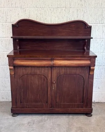 A Victorian mahogany chiffonier, the galleried back with integral shelf above a rectangular top set with two frieze drawers, above a pair of cupboard doors