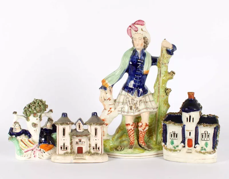 A 19th Century Staffordshire Pottery Group of Four A 19th Century Staffordshire Pottery Group of Four , comprising a Scottish Highlander figurine