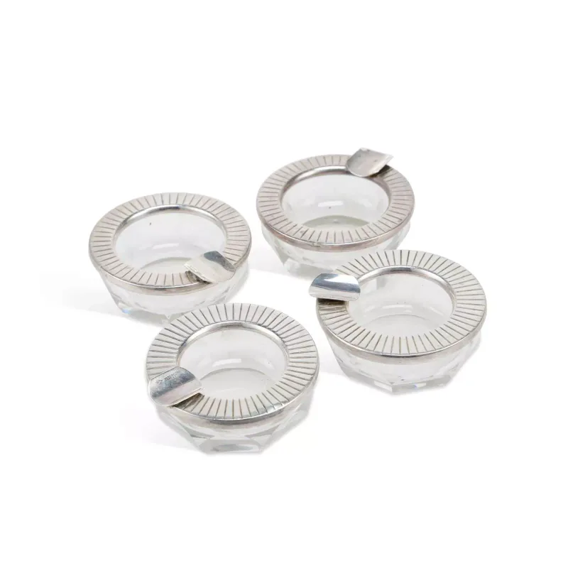 A Set Of Four Argentinean Modernist Silver-Mounted Cut-Glass Ashtrays marked Industria Argentina and 925, of faceted circular form