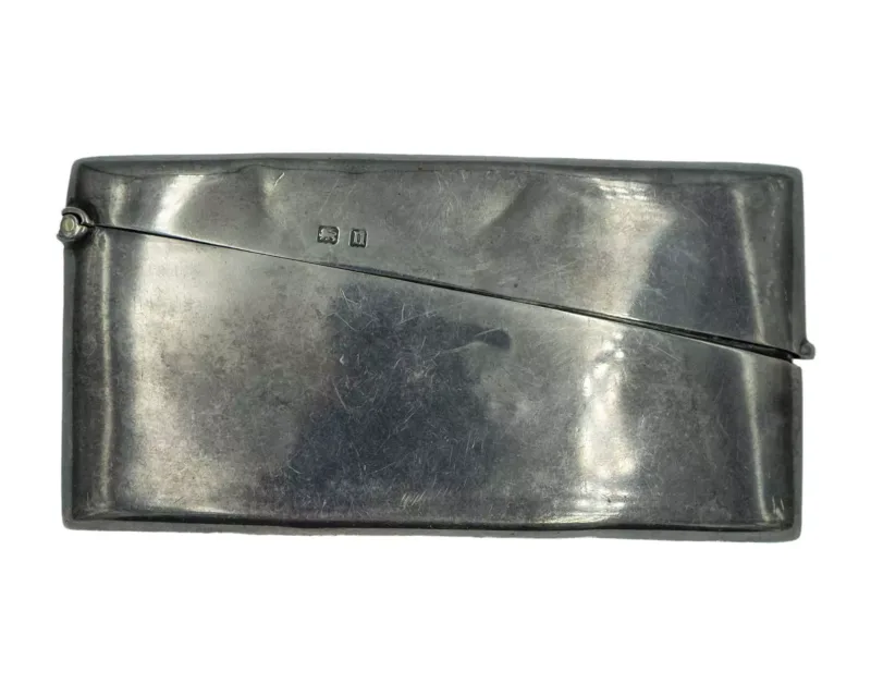 A silver card case by W J Myatt & Co