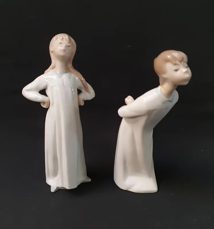 Two Lladro Figurines comprising 'Boy Kissing', 4869, 21cm high
